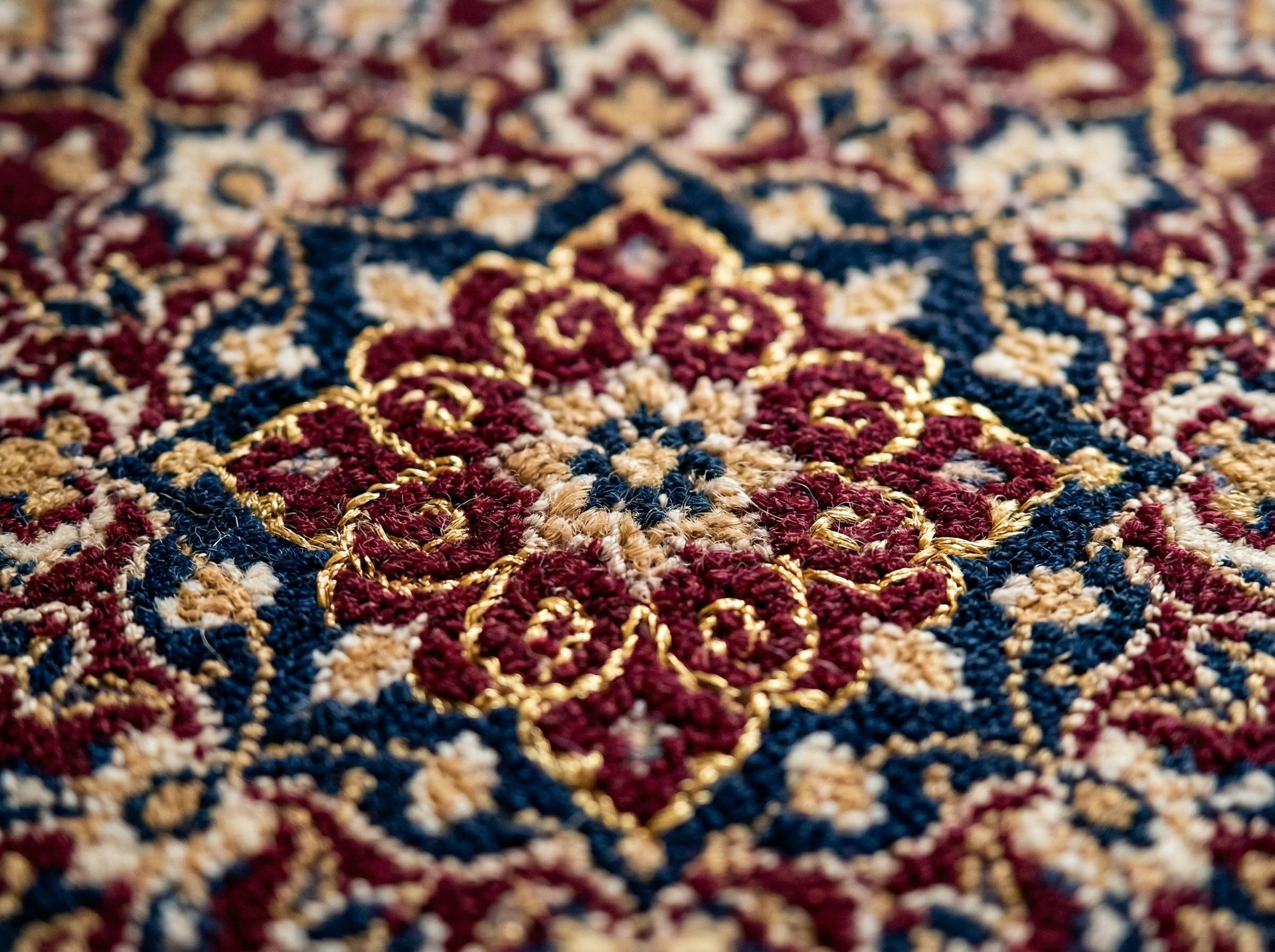 Close-up of intricate hand-knotted oriental rug pattern showing fine craftsmanship